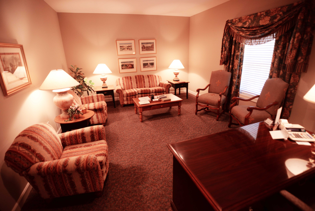 A living room filled with furniture and a desk