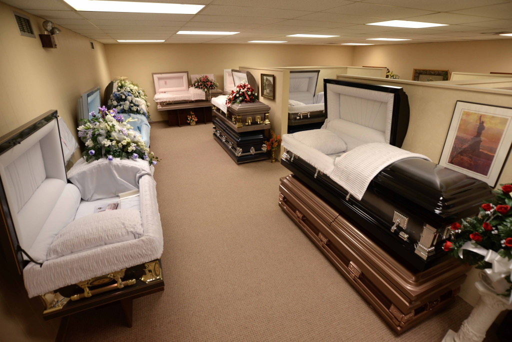 There are many different types of coffins in this room.