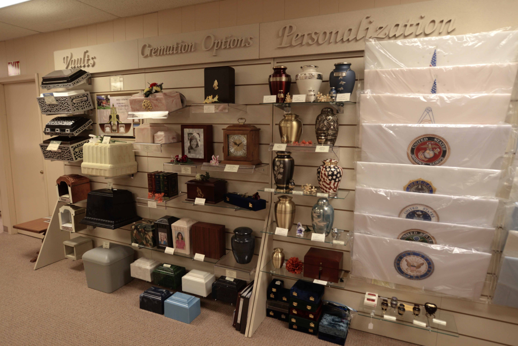 A wall with a lot of urns and boxes on it