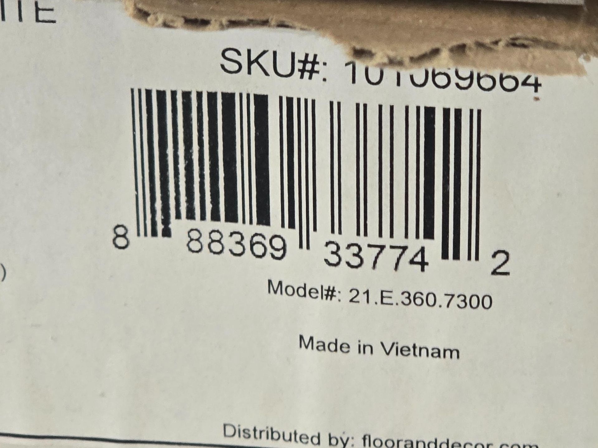 Barcode on a cardboard box, with SKU and model number visible. 