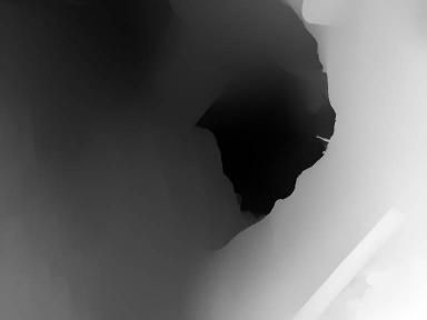 Abstract, dark, grayscale composition with a large, irregular black shape against varying shades of gray.