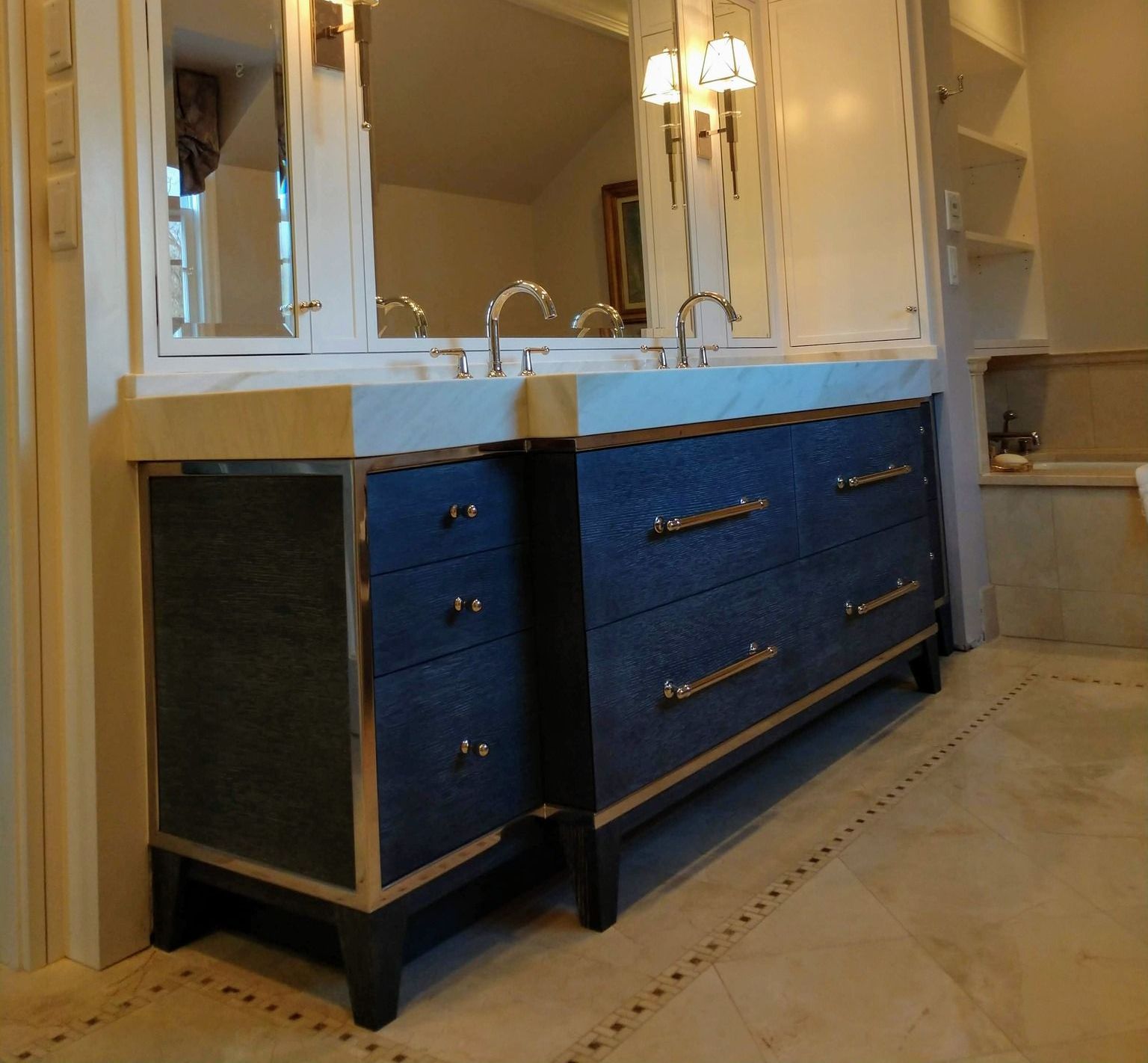 A bathroom with two sinks and a mirror