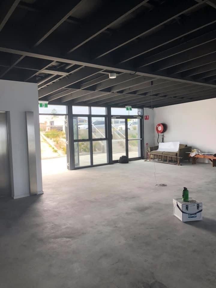 It Is A Conference Room With A Long Table And Chairs — Blake Saunders Painting In Edgeworth, NSW