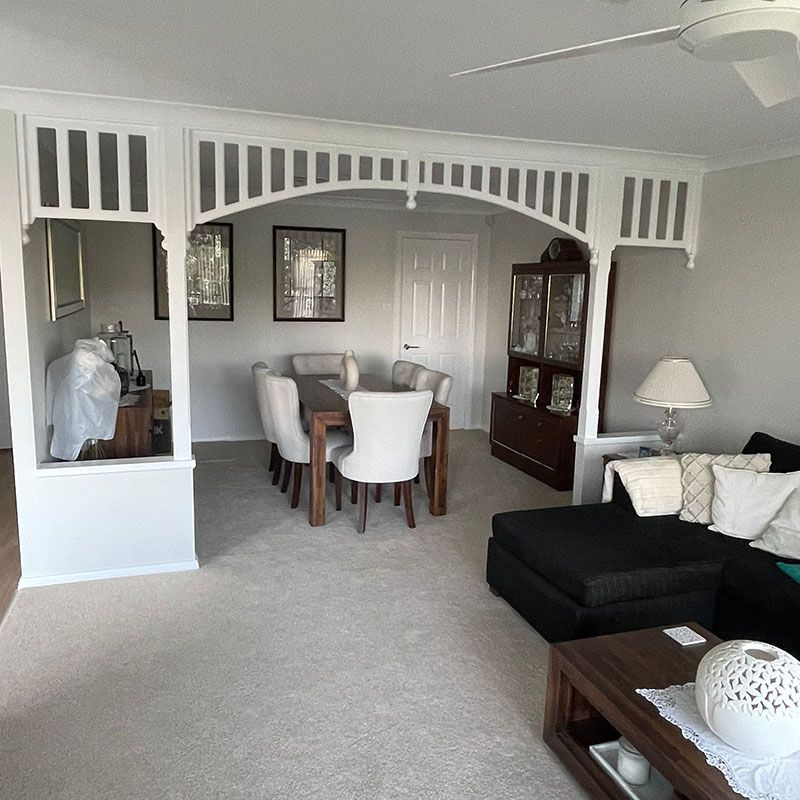 A Living Room With A Dining Room Table And Chairs — Blake Saunders Painting In Edgeworth, NSW