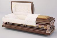 a wooden coffin with the lid open is sitting on a table .