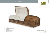 light brown wood casket with white liner