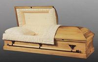 light wooden casket with the lid open 