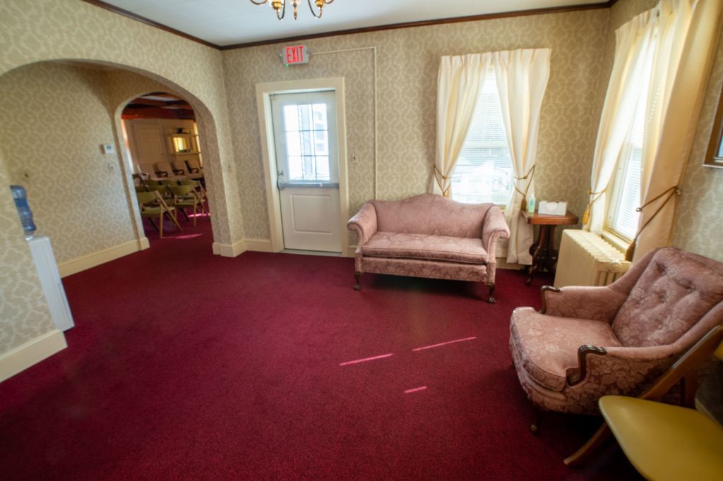 there is a couch and a chair in the room .