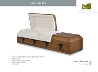 light brown wood casket with white liner