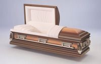 a coffin with the lid open is sitting on a table .