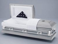 a silver casket with a flag inside of it .