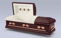 a brown coffin with the lid open is sitting on a table .