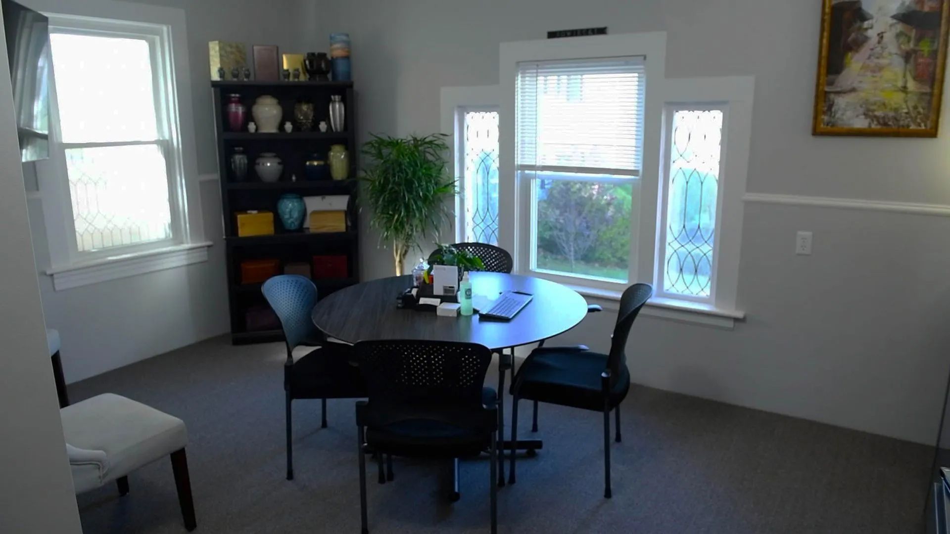 a room with a table and chairs in it
