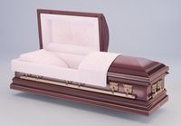 a brown metal coffin with the lid open and a white blanket .