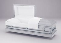 a brown coffin with the lid open on a white surface .