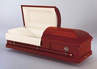 a brown metal coffin with the lid open and a white blanket .