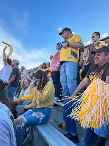 A Group of People Watching in the Stadium — Cheyenne, WY — Treasure Abilities