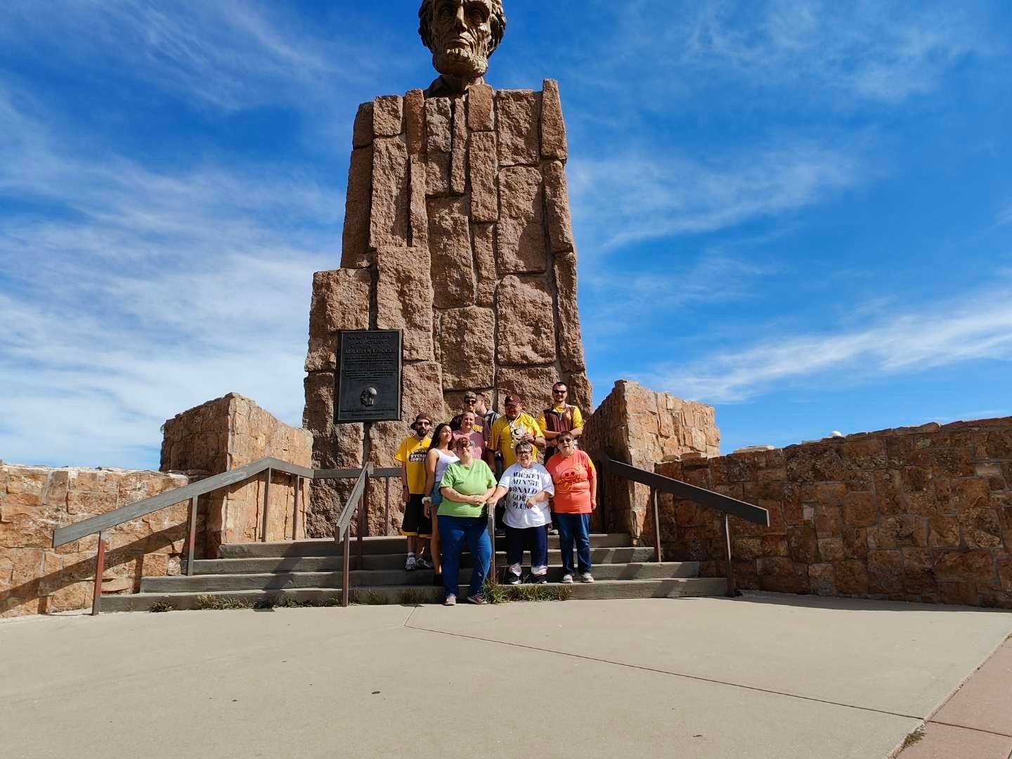Group of Happy People Beside the Big Statue — Cheyenne, WY — Treasure Abilities