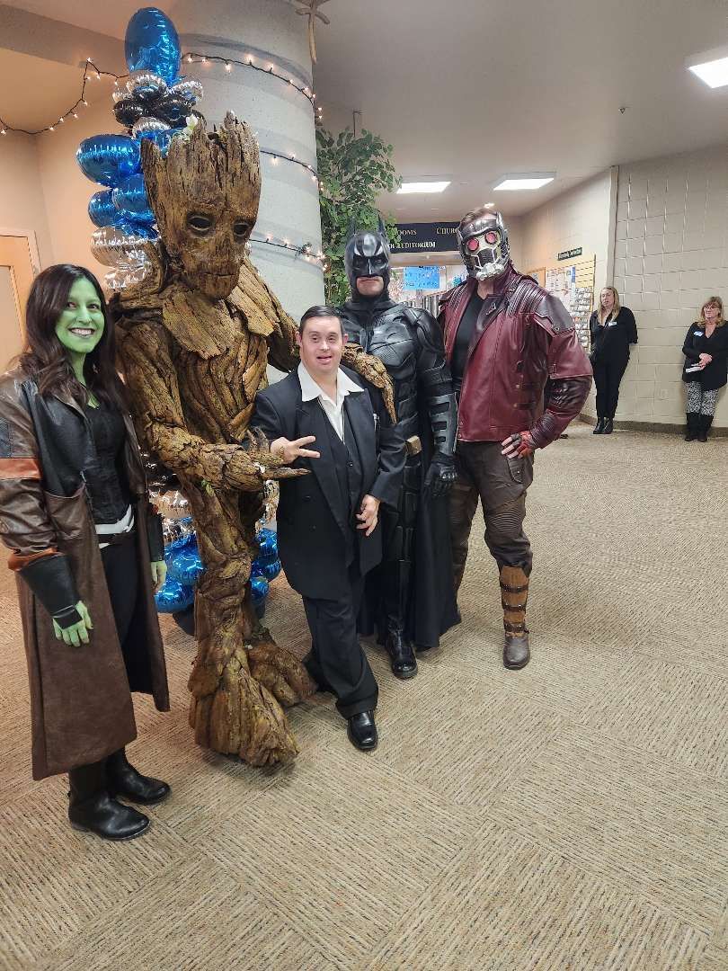 Man with Down Syndrome with People in Costume — Cheyenne, WY — Treasure Abilities