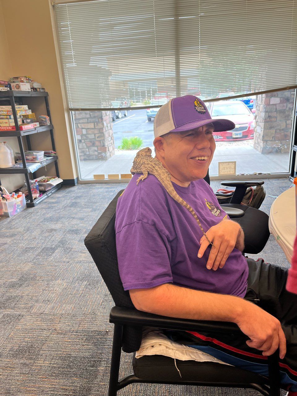 A Man in a Purple Shirt Has a Lizard on His Shoulder — Cheyenne, WY — Treasure Abilities