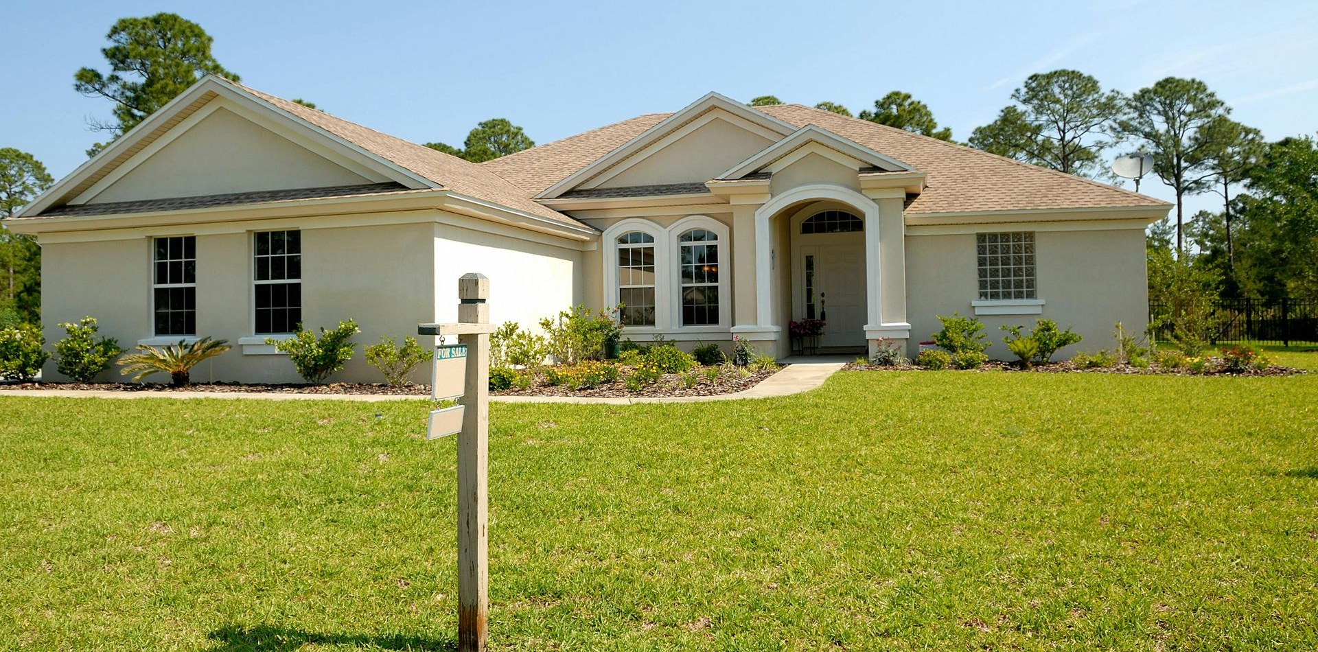 home with a for sale sign out front