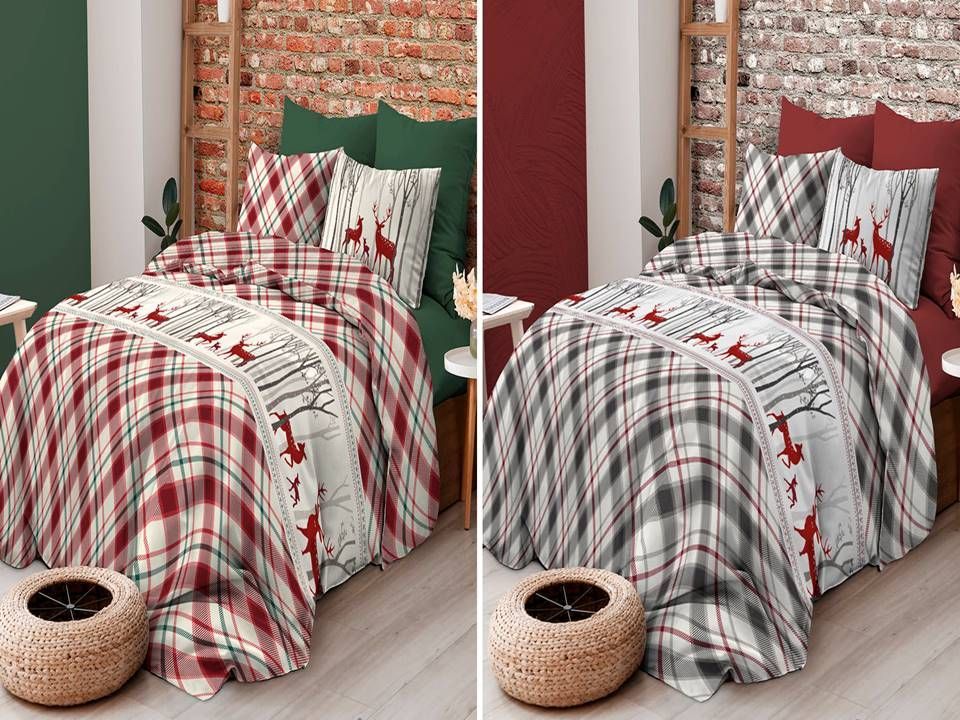 Un letto con sopra un piumone a quadri e dei cuscini.