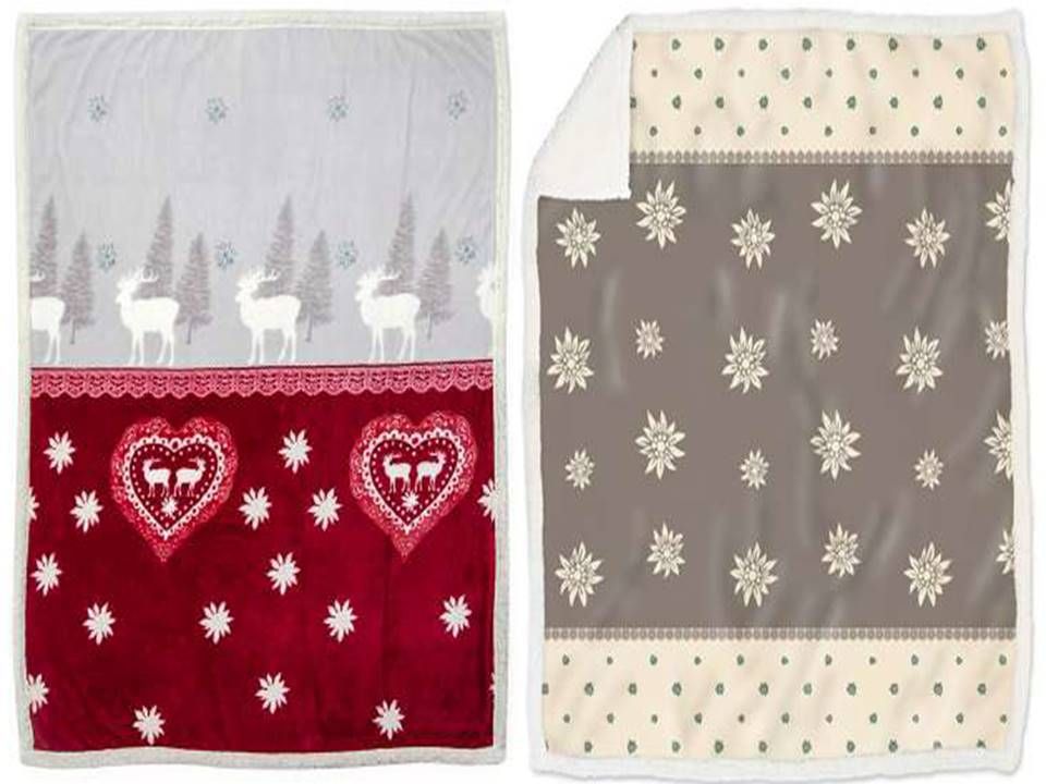 Due coperte con cervi e fiocchi di neve sopra