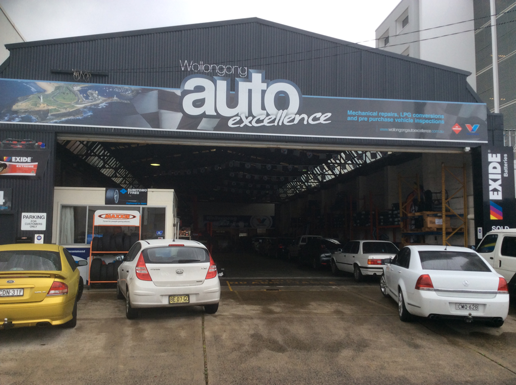 A Mechanic's Garage With Cars In Front Of it — Wollongong Auto Excellence In Wollongong, NSW