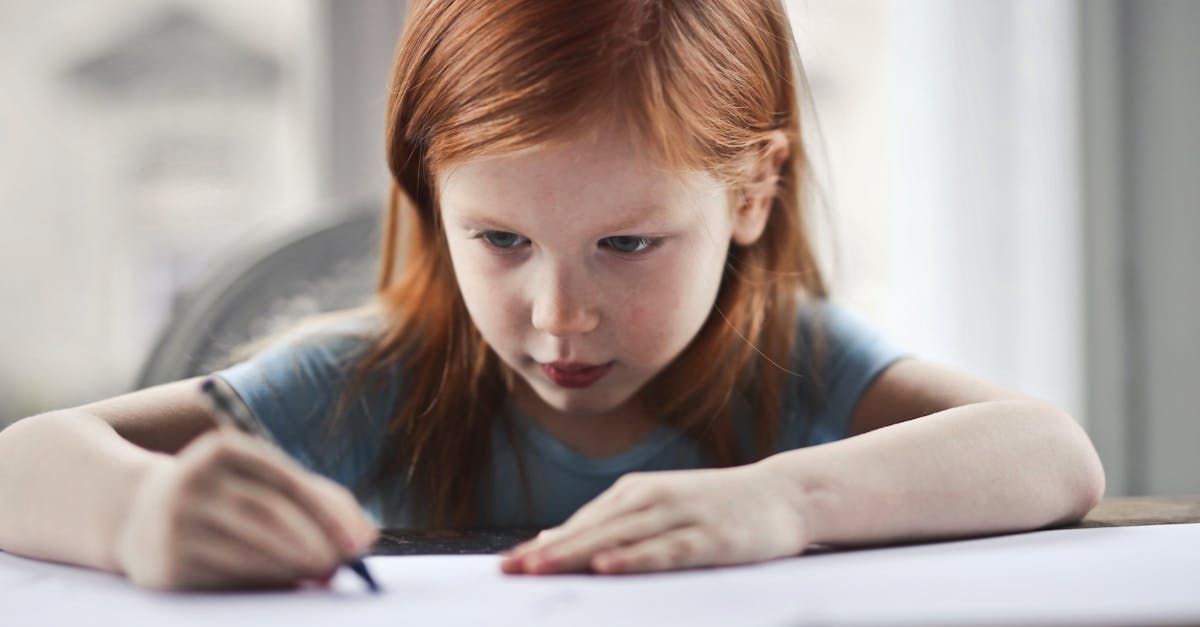 Little girl doing her homework at a desk