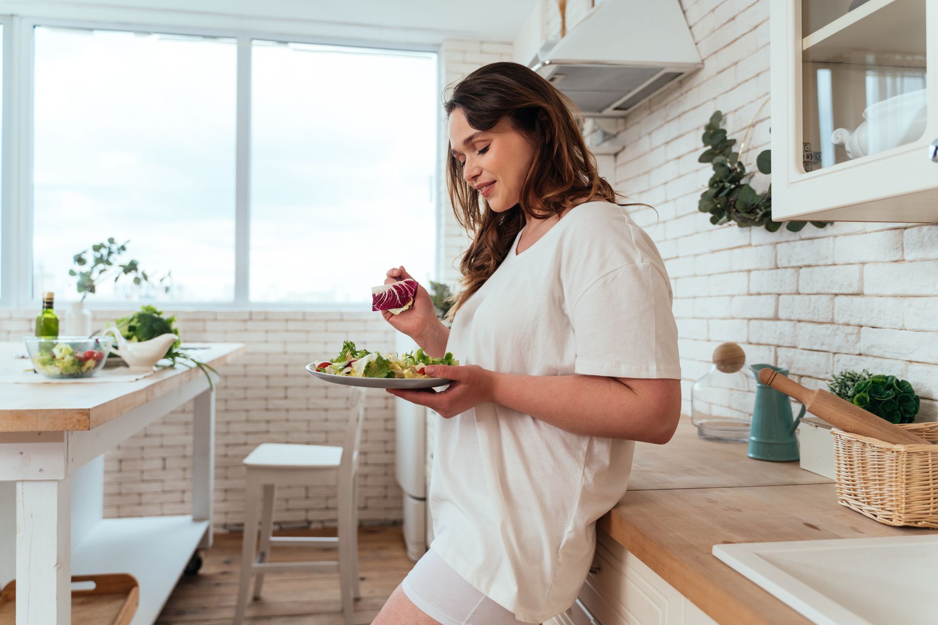woman after weight loss eating healthy at home