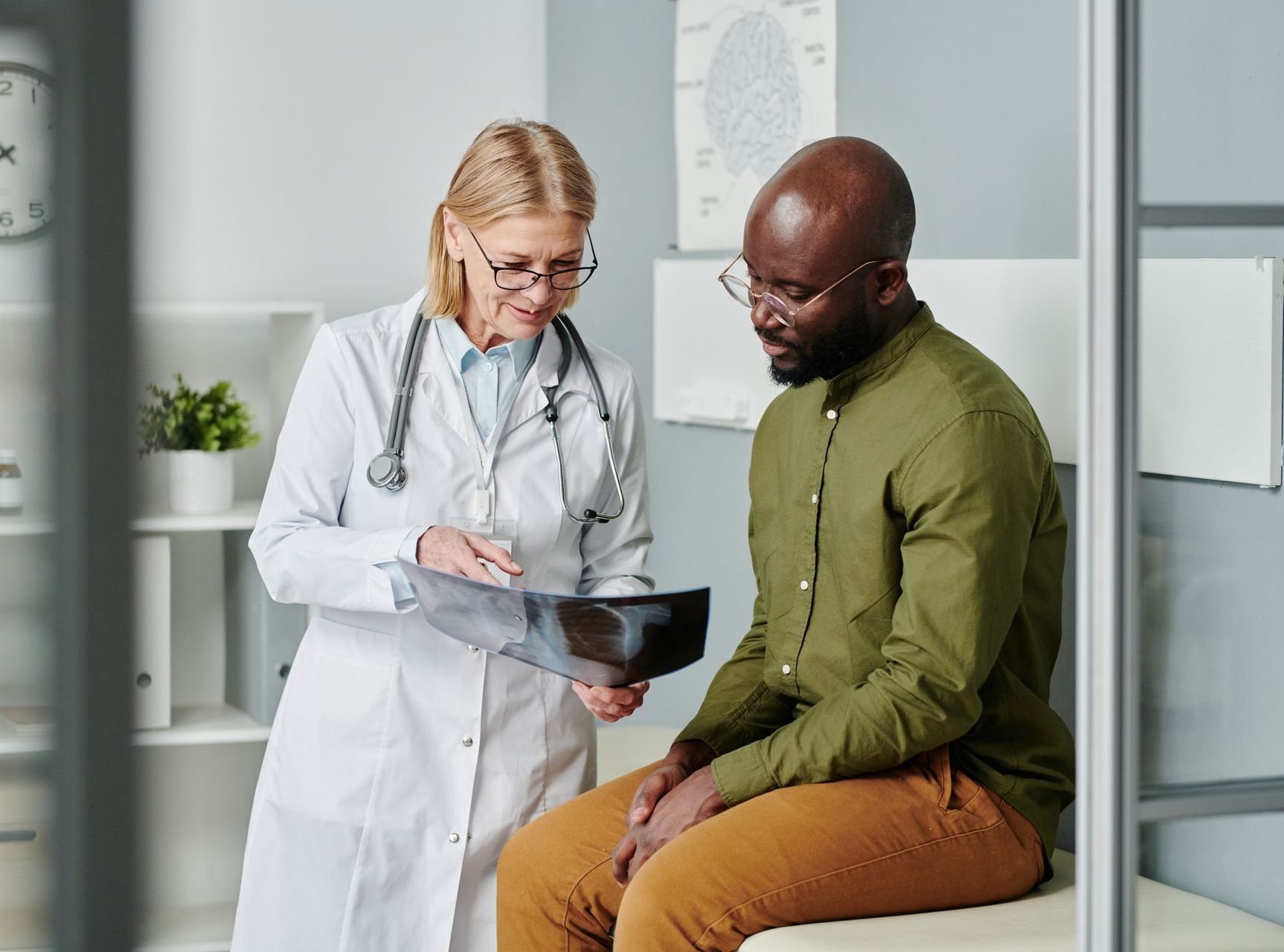man and nurse consultation in modern clinic