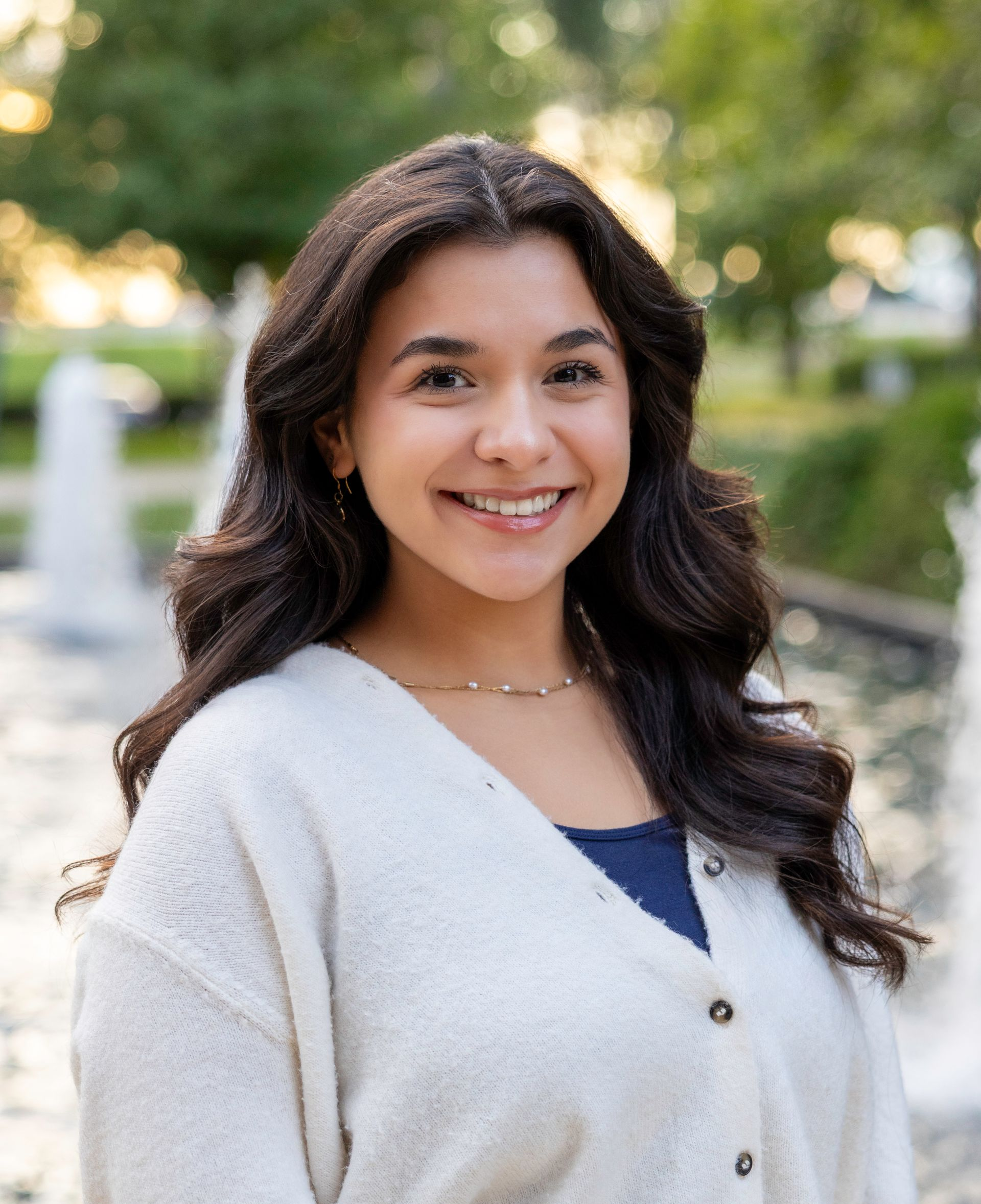 A man in a suit and tie is smiling for the camera.