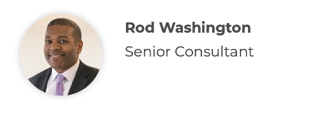 Rod Washington, Senior Consultant. Headshot of a smiling man in a suit, with a purple tie.