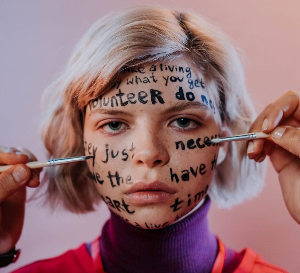 picture of girl with face painted with words as guide