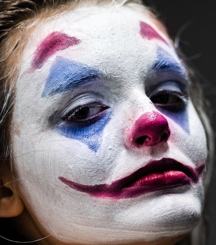 woman with clown(Joker) face paint