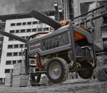 A generator is parked in front of a building under construction.