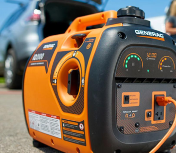 A generac generator is plugged into a car