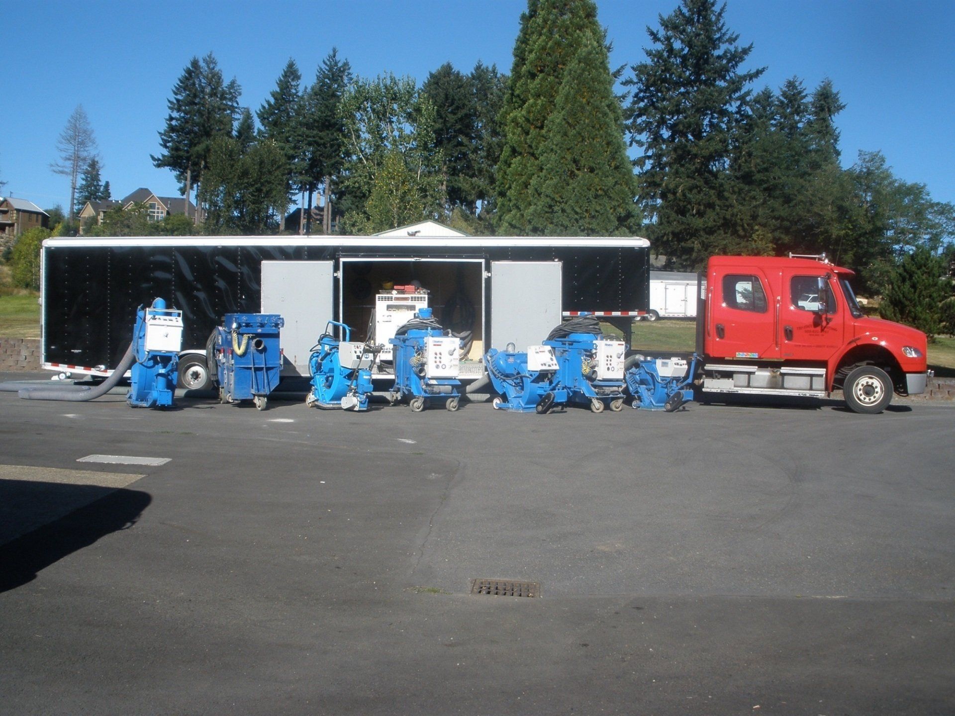 several shotblasting machines in front of large truck and trailer in Oregon City, OR