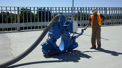 worker doing shotblasting on a roof in Oregon City, OR