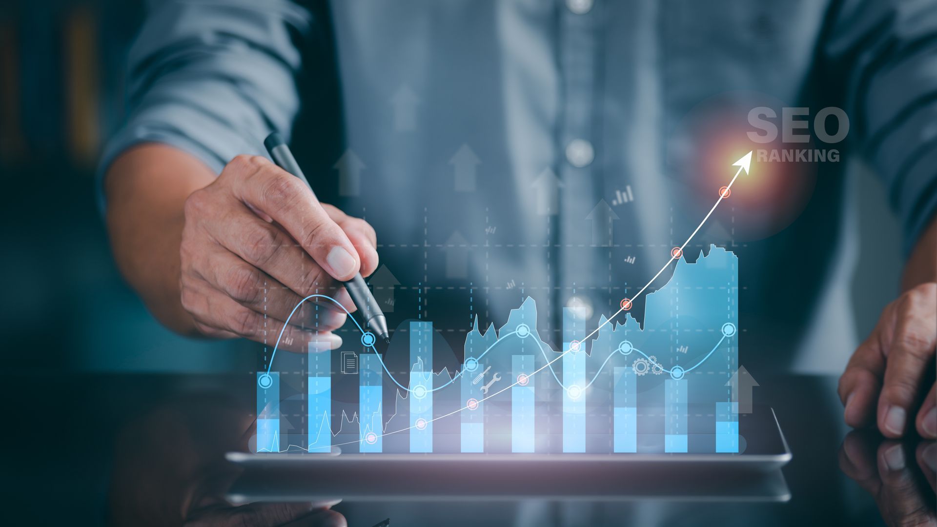 Man pointing to a digital graph of SEO ranking — Twiss Digital Marketing in Idaho Falls