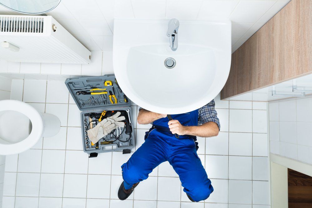 plumber repairing a leakage