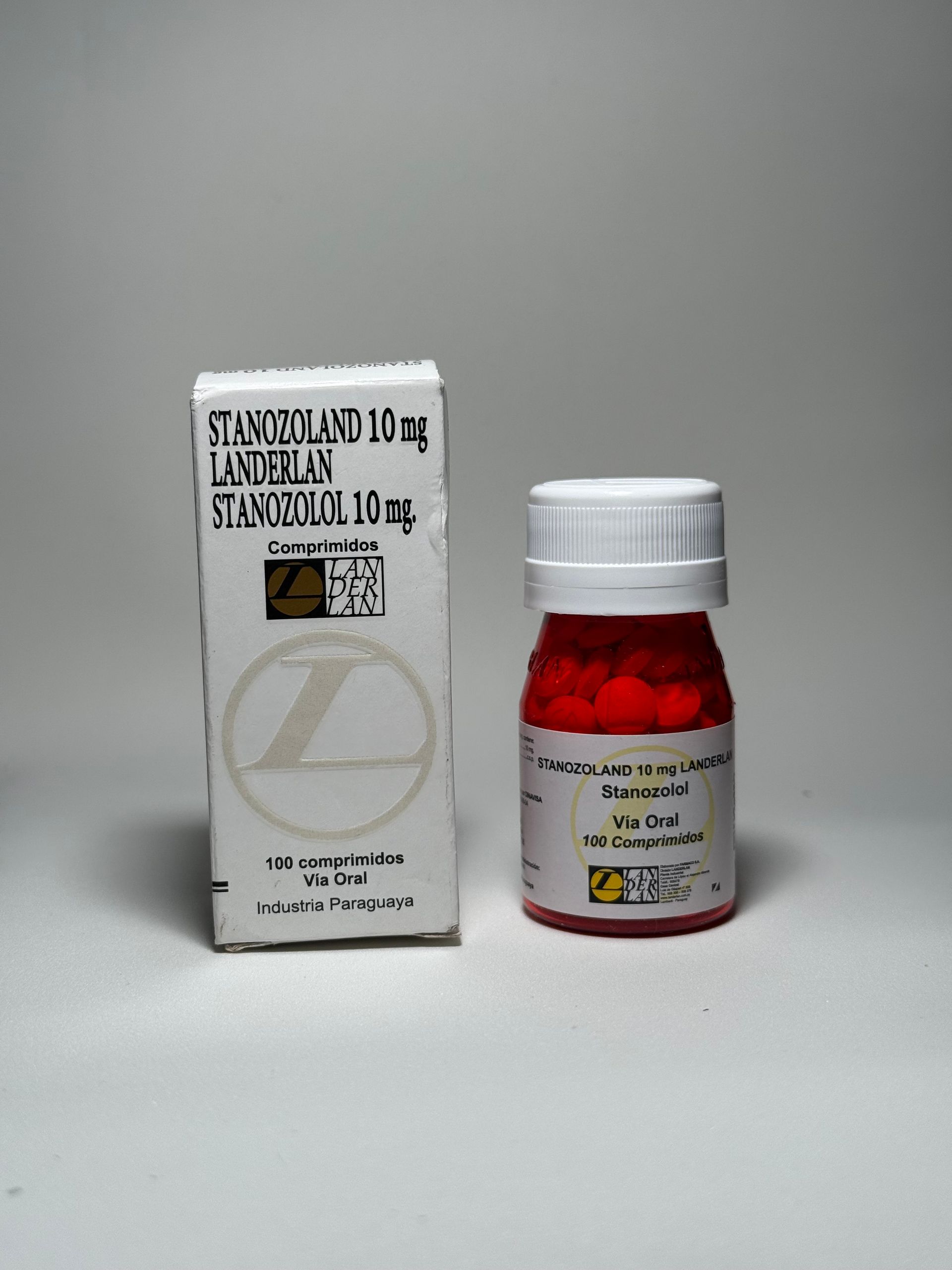 Caja y frasco de comprimidos rojos y redondos etiquetados como 