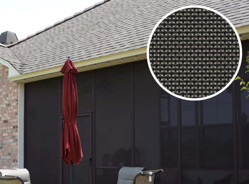 Screened-in patio with a closed red umbrella. Close-up of screen shows dark, woven texture.