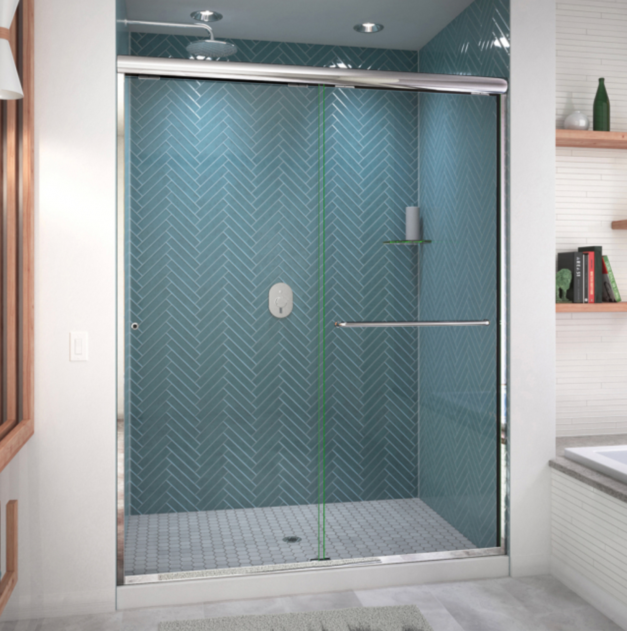 Shower with sliding glass door and teal herringbone tile.