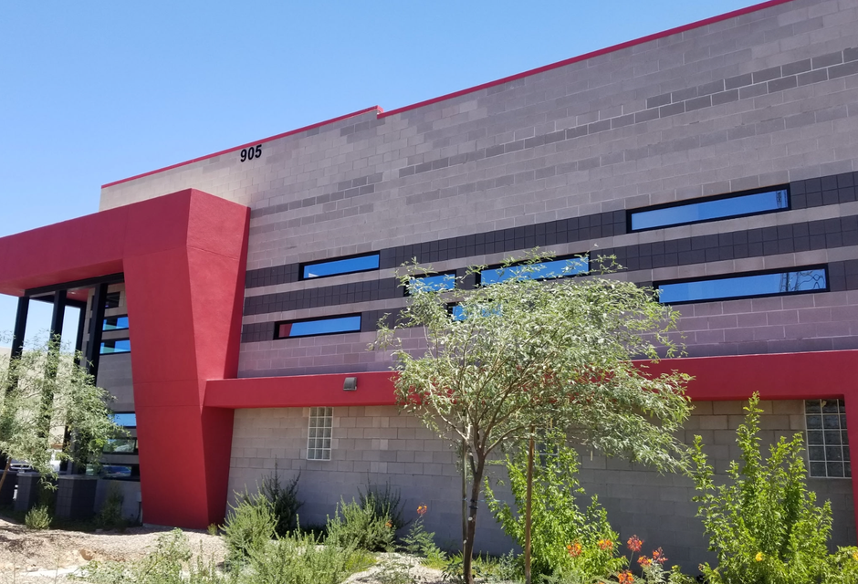 Barnes & Noble bookstore with a white truck parked in front under a clear blue sky.