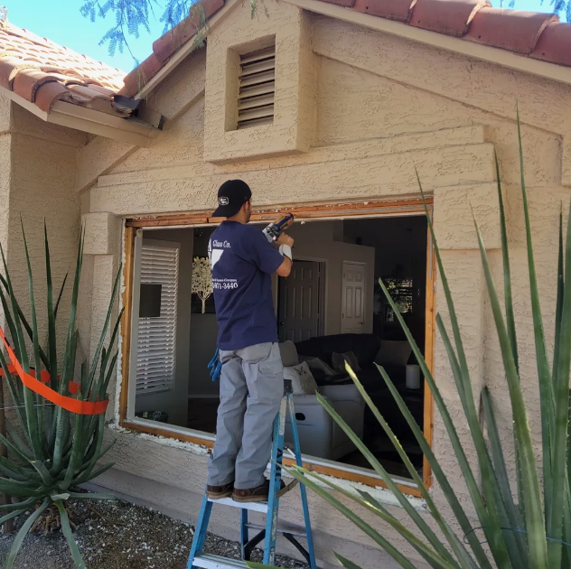ABC Glass Company technician installing window glass replacement on a Phoenix Arizona home