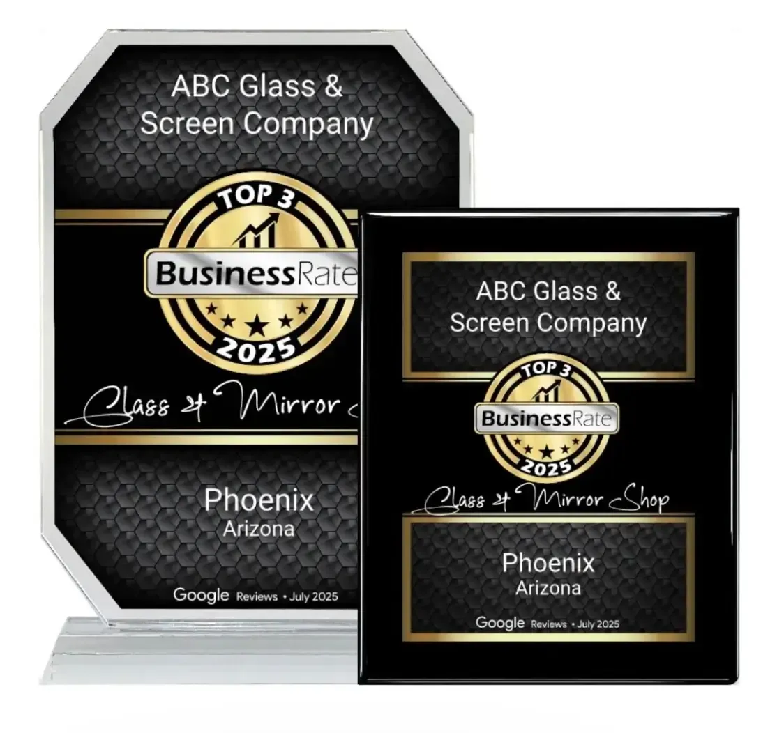 Two black-and-silver award plaques for ABC Glass & Screen Company with a gold “Top Business Rate 2025” badge.