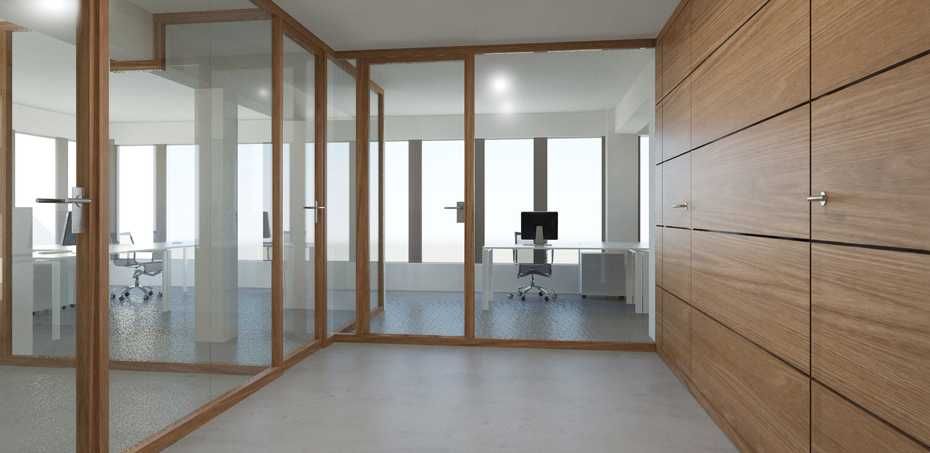 Modern office space with glass walls, wooden accents, and a desk with a computer.