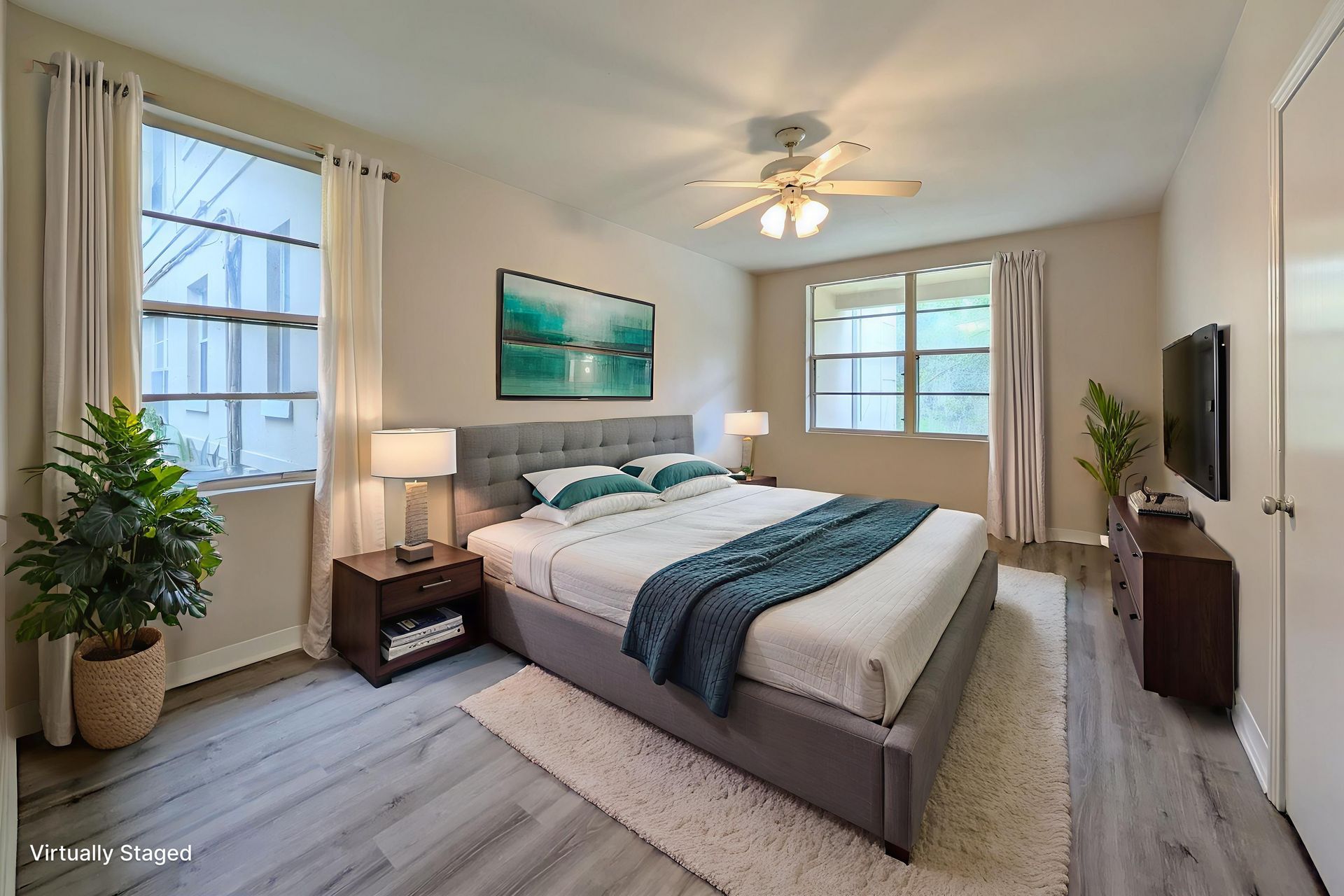 Dining area with table, chairs, bar stools, and access to kitchen and hallway.