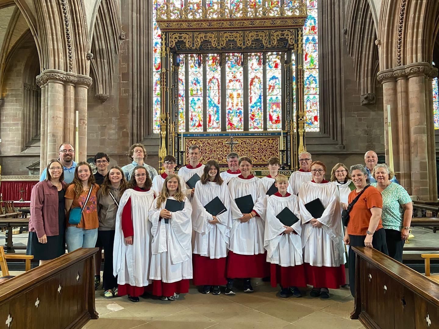 A group of people posing for a picture in a church